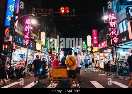 The Guangzhou Street Night Market alive at night in Taipei, Taiwan Stock Photo