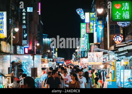 The Guangzhou Street Night Market alive at night in Taipei, Taiwan Stock Photo