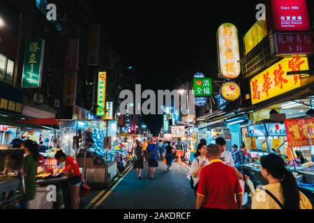 The Guangzhou Street Night Market alive at night in Taipei, Taiwan Stock Photo