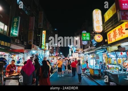 The Guangzhou Street Night Market alive at night in Taipei, Taiwan Stock Photo