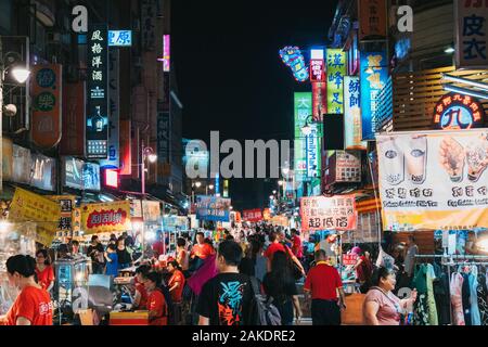 The Guangzhou Street Night Market alive at night in Taipei, Taiwan Stock Photo