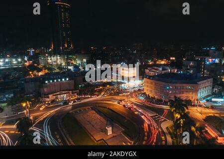 Long exposure looking down on traffic as it goes around the roundabout in front of Tainan Station, Tainan City, Taiwan Stock Photo