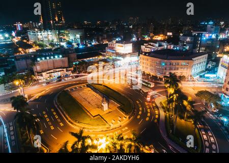 Long exposure looking down on traffic as it goes around the roundabout in front of Tainan Station, Tainan City, Taiwan Stock Photo