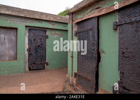 Rusted and worn out steel doors in outdoor industrial complex area Stock Photo
