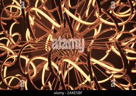 Abstract curved shapes on a stainless steel lamp. Stock Photo