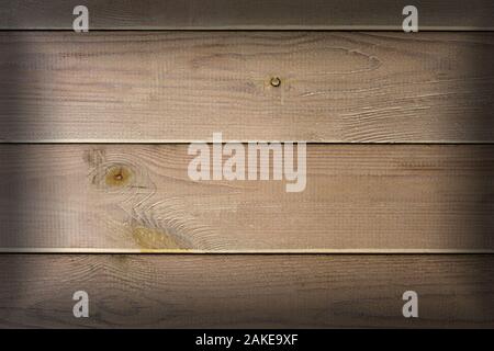 Rustic wood board background with nice studio lighting and elegant vignetting to draw the attention Stock Photo