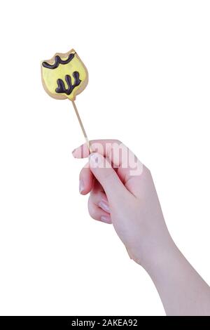 Woman's hands holding a Valentine cookie isolated on white background. Stock Photo