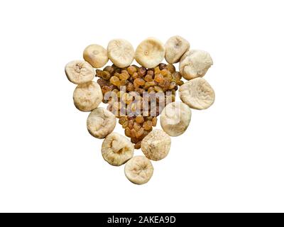 Assortment of dried figs and raisins in the form of heart isolated on white background. Stock Photo