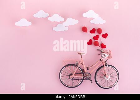 Happy valentines love story concept of a romantic couple against chalk  drawings background. Male riding his girlfriend in a front bicycle basket  Stock Photo - Alamy