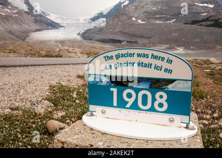 Sign marking the former extent of The Athabasca glacier. The glacier has lost 60 percent of its ice in the last 150 years. Rocky Mountains, Alberta, Canada. August 2012. Stock Photo