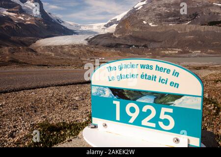 Sign marking the former extent of the Athabasca glacier, in 1925. The glacier has lost 60 percent of its ice in the last 150 years. Rocky Mountains, Alberta, Canada. August 2012. Stock Photo