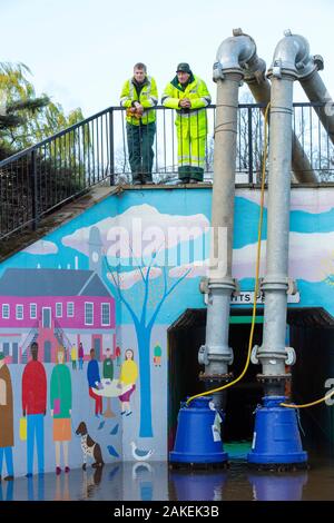 Environment Agency staff pumping out floodwater from Hardwicke Circus in Carlisle, Cumbria on Tuesday 8th December 2015, after torrential rain from storm Desmond. England, UK, December 2015. Stock Photo