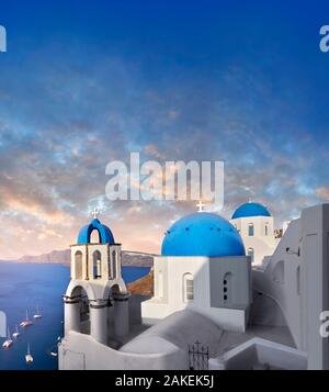 Sunset over the traditional Greek Orthodox churches of Oia (ia), Cyclades Island of  Thira, Santorini, Greece.  The settlement of Oia had been mention Stock Photo