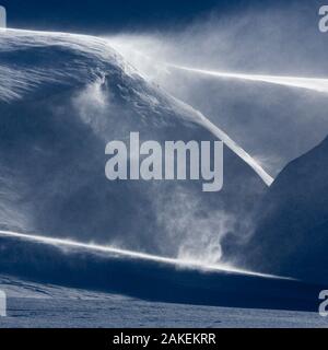 Drifting snow in landscape from Svalbard, Norway. April Stock Photo