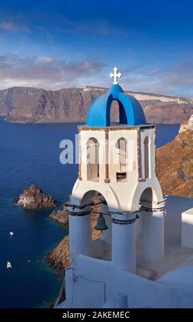 Bell tower of traditional blue domed Greek Orthodox church of Oia, Thira Island, Santorini Greece. Stock Photo