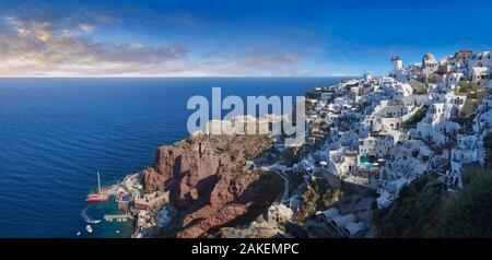 Panoramic view of traditional blue domed Greek Orthodox church of Oia, Island of Thira, Santorini, Greece. Stock Photo