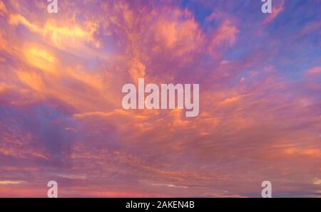 beautifully lit clouds during sunrise Stock Photo