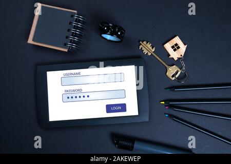 Username and Password. Internet connection, social media, service delivery, security systems and communication concept. Tablet computer on a black office desk Stock Photo