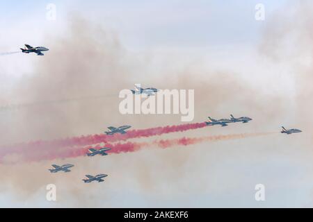 LINATE MILAN, ITALY October 12 2019  - military jets of Italian Aerobatic Military team "PAN" through their colored smokes in flight at airshow, shot Stock Photo