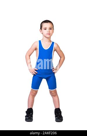 The concept of a little fighter athlete. Little funny boy in a  blue sports tight holding hands on the waist, looking at the camera on a white isolate Stock Photo