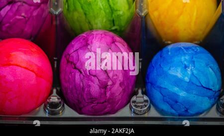 Pink Easter egg in the middle of other Easter eggs Stock Photo