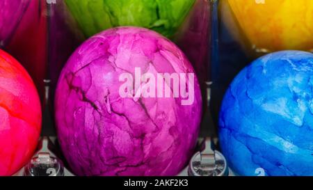 Pink Easter egg in the middle of other Easter eggs Stock Photo