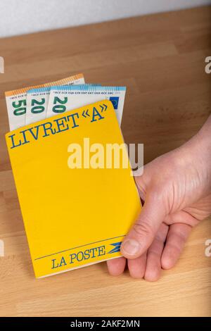 Paris, France - January 09, 2020 : Livret A, 'Laposte' postal savings book in the hand of a person Stock Photo