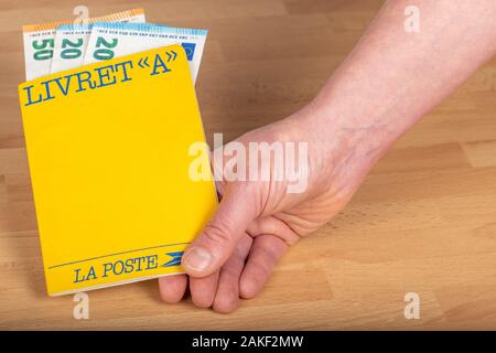 Paris, France - January 09, 2020 : Livret A, 'Laposte' postal savings book in the hand of a person Stock Photo