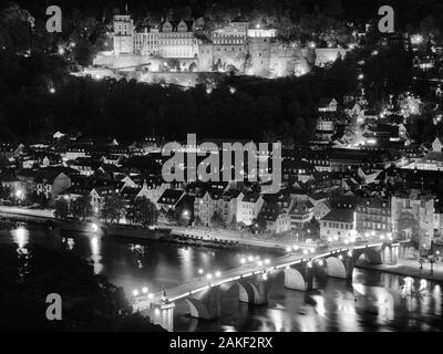 View of Heidelberg castle, Old Bridge and Old Town at night in black and white Stock Photo