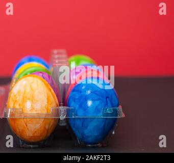 Plastic bowl full of colourful Easter eggs Stock Photo