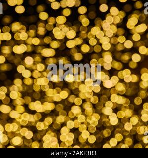 Background and pattern of intentionally blurred small yellow lights Stock Photo