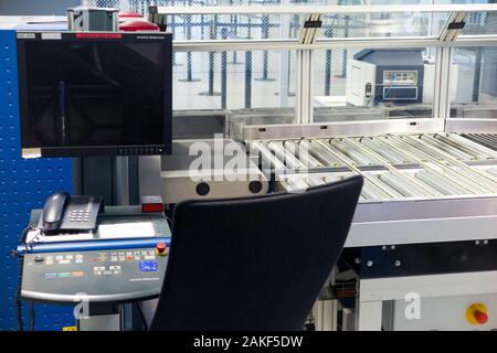 Airport x-ray / X ray security luggage baggage scanner and rollers / rolling belt to transport passengers cases and bags through the machine, made by Smiths Detection. (115) Stock Photo
