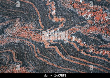 Abstract red pattern in a smooth stone slab Stock Photo