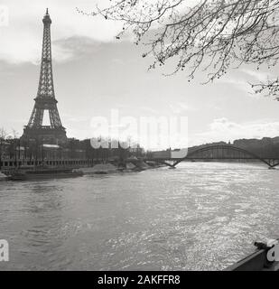 1950s, historical, a view from this era from across the river Seine of the famous french landmark, the Eiffel Tower, Paris, France. Stock Photo