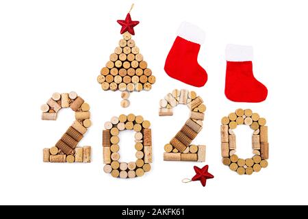 Isolated Christmas background made of wine corks. New Year 2020 isolated on white background. Stock Photo