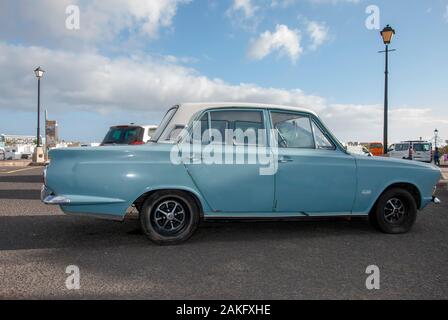 1960's Model Light Blue White Mark One Ford Cortina Motor Car right hand passengers side view of rusty lhd left hand drive four door 4 door ford corti Stock Photo