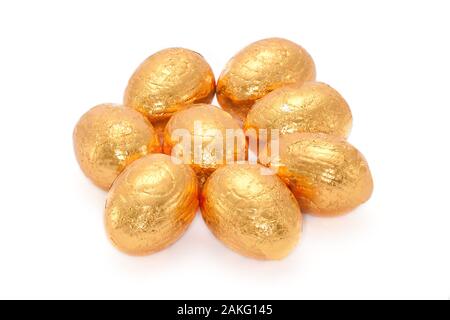 Group of Mini Golden Chocolate Eggs on White Background Stock Photo