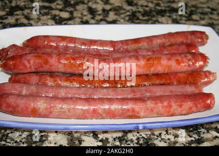 The sausages are baked in the oven Stock Photo