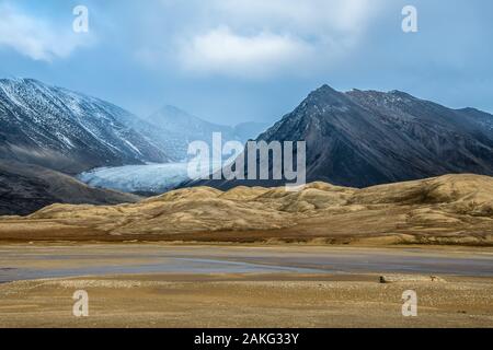 glacier between rocky mountains - amazing landscape in the arctic Stock Photo