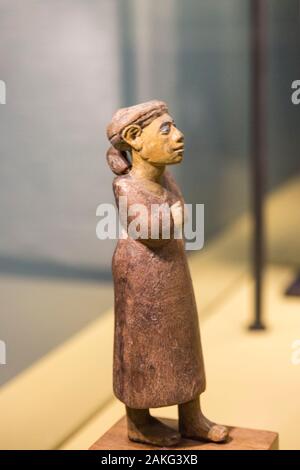 Opening visit of the exhibition 'Sésostris III, pharaon de légende”, Lille, France. Statuette of a foreign woman, with her child on the back. Stock Photo