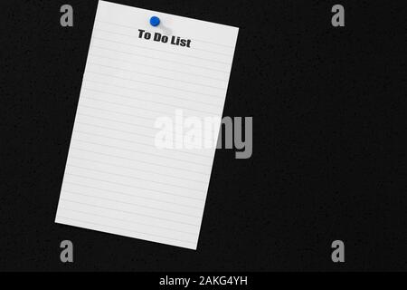 To do list on a page from a notebook stuck onto a black cork background with a drawing pin Stock Photo