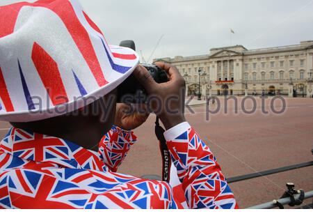 Joseph Afrane takes a photo at Buckingham Palace before Trooping the Colour Stock Photo