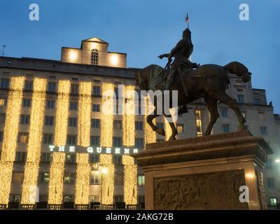 Fairy lights at dusk on The Queens Hotel and The Black Prince Statue in City Square Leeds West Yorkshire England