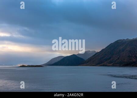 Sørøya from Sørøysundet, Hammerfest Municipality, Vest-Finnmark, Northern Norway, under a dramatic sky Stock Photo