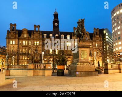 The Old Post Office Building and Black Pronce Statue at dusk in City Square Leeds West Yorkshire England