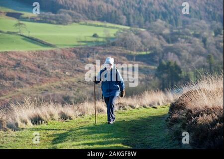 Elderly couple climbing Hawnby Hill, North Yorkshire, UK Stock Photo