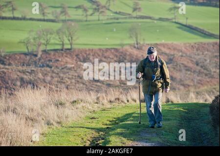 Elderly couple climbing Hawnby Hill, North Yorkshire, UK Stock Photo