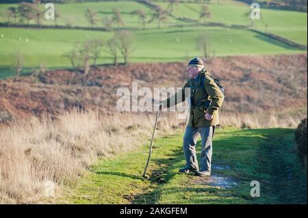 Elderly couple climbing Hawnby Hill, North Yorkshire, UK Stock Photo