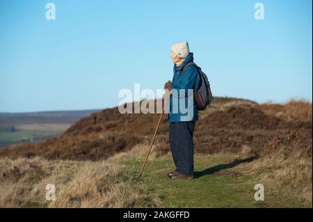 Elderly couple climbing Hawnby Hill, North Yorkshire, UK Stock Photo