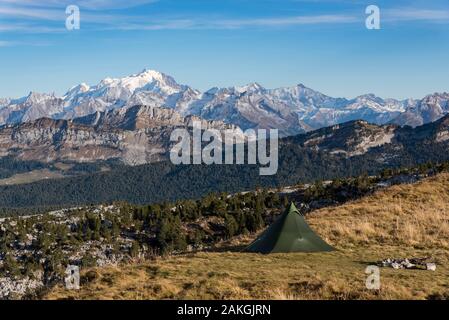 France, Haute Savoie, Bornes massif, Glieres, itinerant trek day 1, bivouac under tent at the top of Parmelan with view towards the Mont Blanc massif Stock Photo